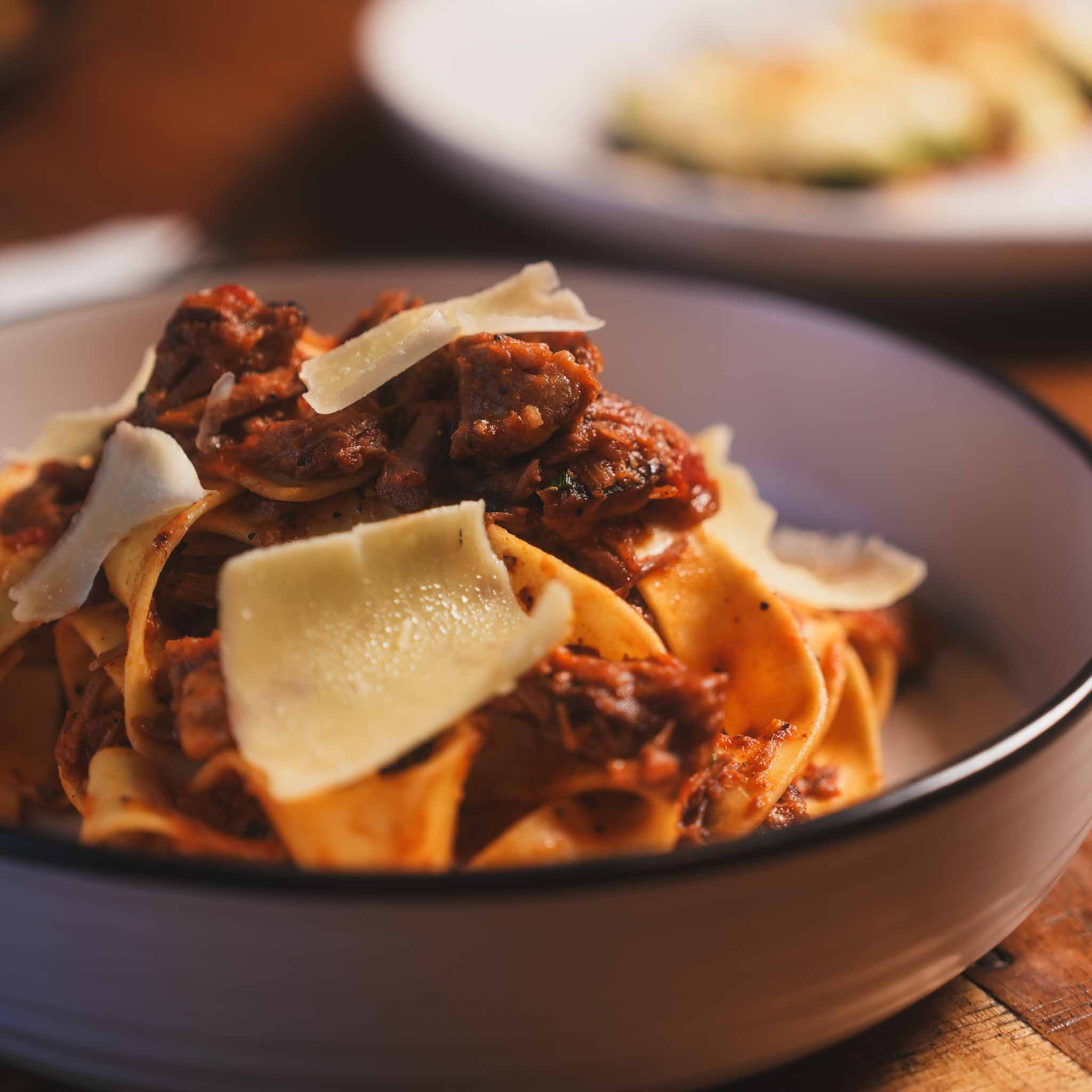 Smoked Brisket Americana Pappardelle | Slow-Smoked Brisket Tossed Through Pappardelle In A Rich Americana-Style Sauce, Finished With Shaved Parmesan | $31.80