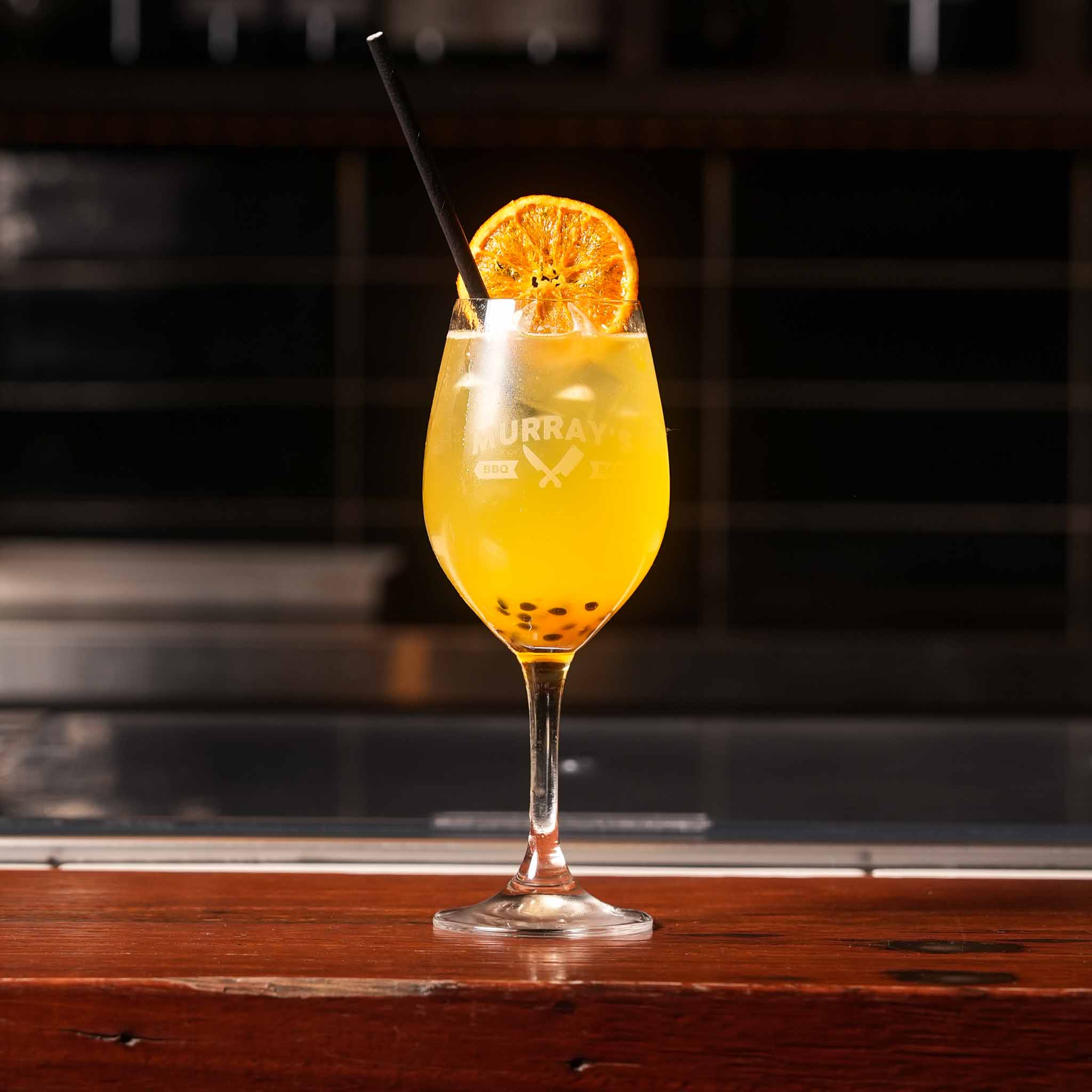 Spring Sunset Spritz | Vodka, Prosecco, Lime Juice, Passionfruit Puree, Lemonade, Ice, Orange Wheel | $18